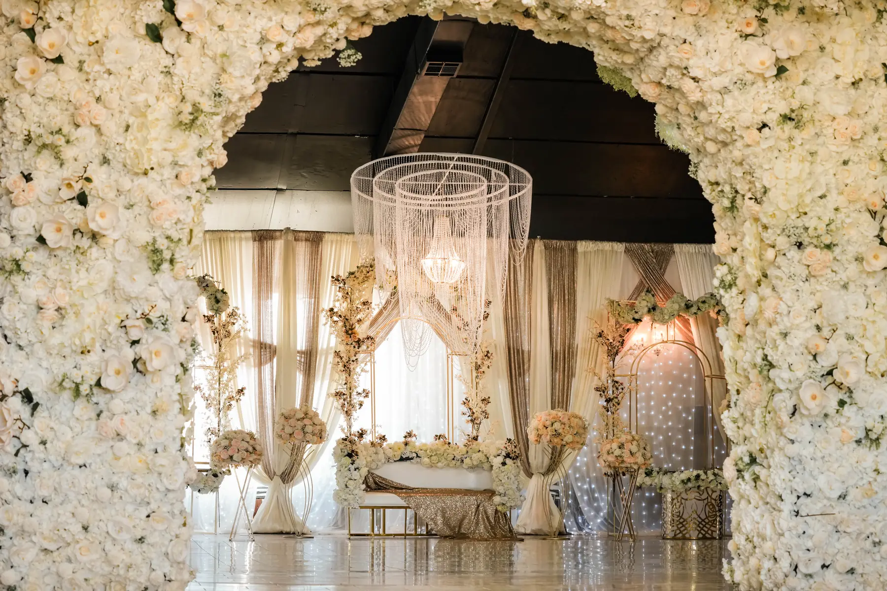 Floral arch head table at Imperial Event Center 1