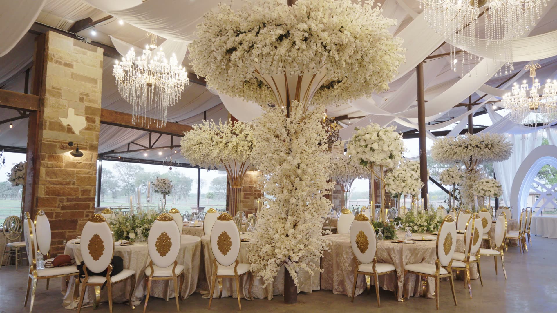 Imperial Grand Events ballroom dressed with floral trees, chandeliers, and reception tables